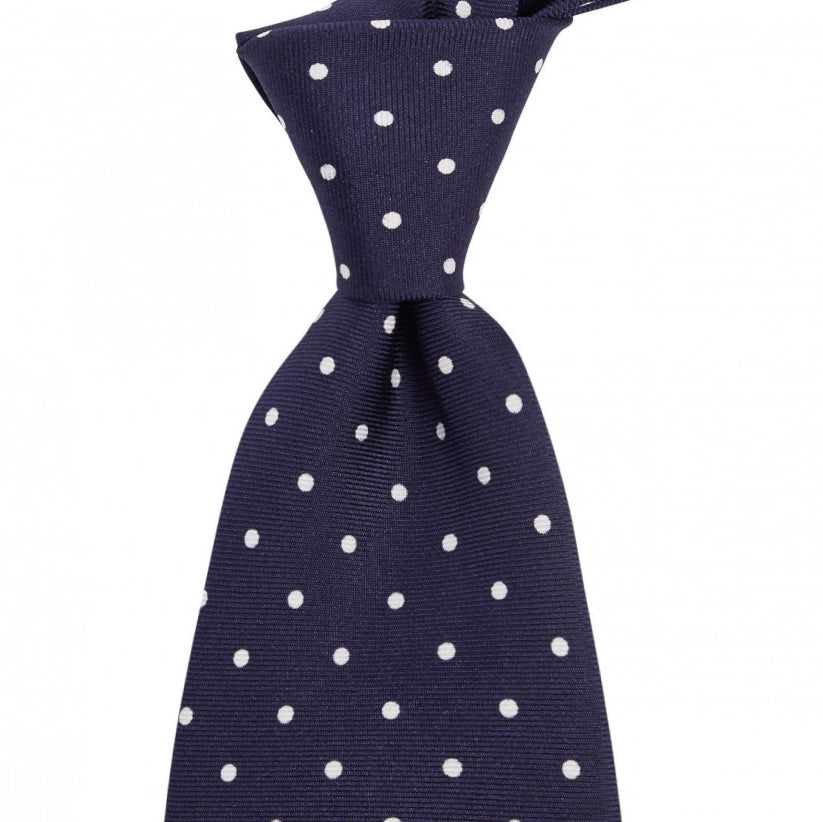 A Sovereign Grade Navy White London Dot Printed Silk Tie by KirbyAllison.com on a white background of excellent quality.
