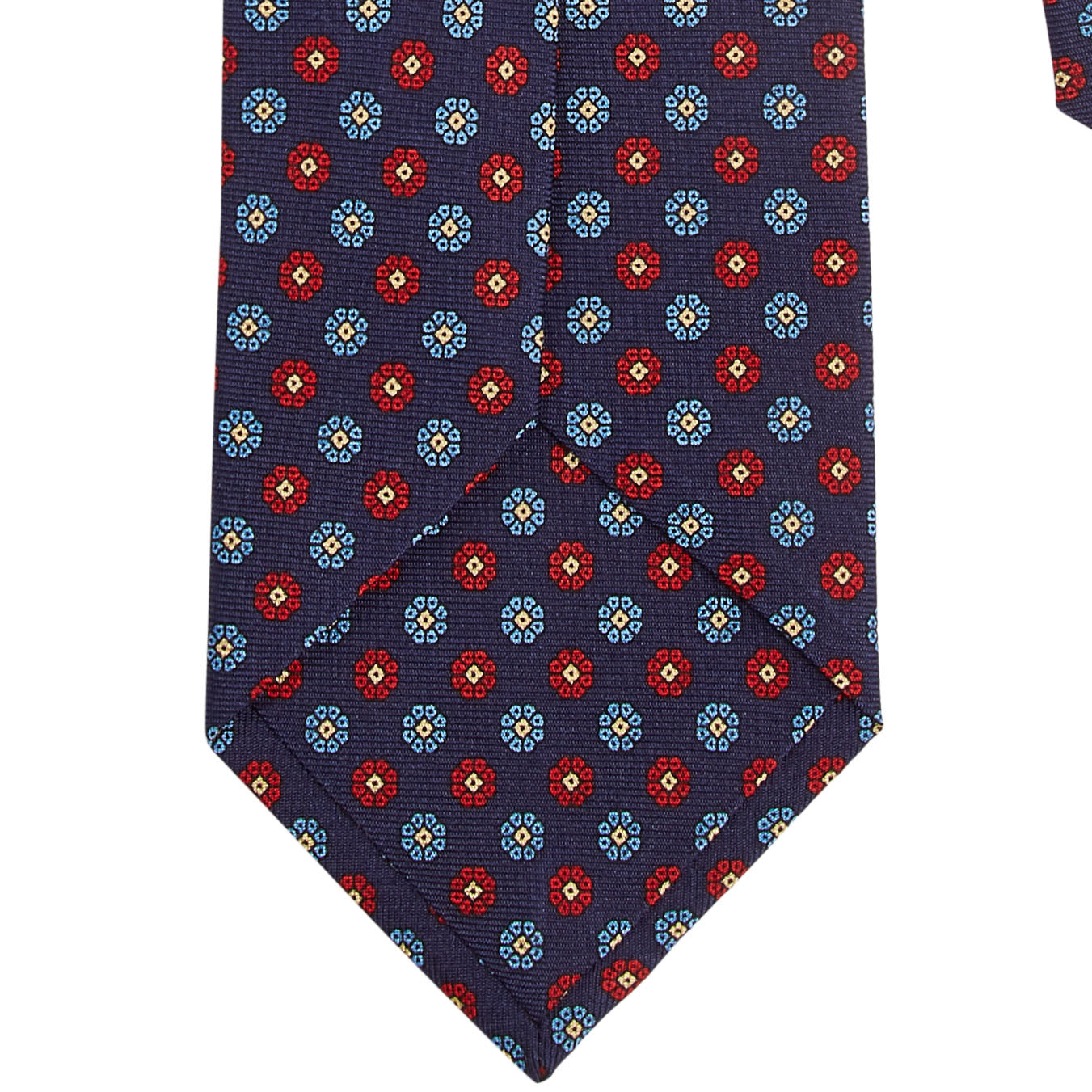 A Sovereign Grade Macclesfield Corn Floral Motif tie by KirbyAllison.com showcasing quality with blue flowers on a red background.