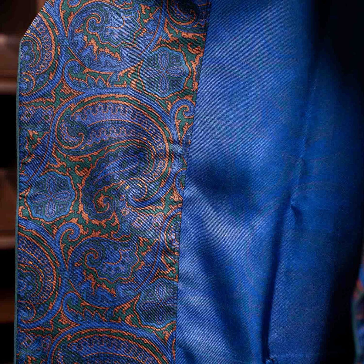 A well-dressed gentleman wearing a Sovereign Grade Ancient Madder Dressing Gown from KirbyAllison.com.