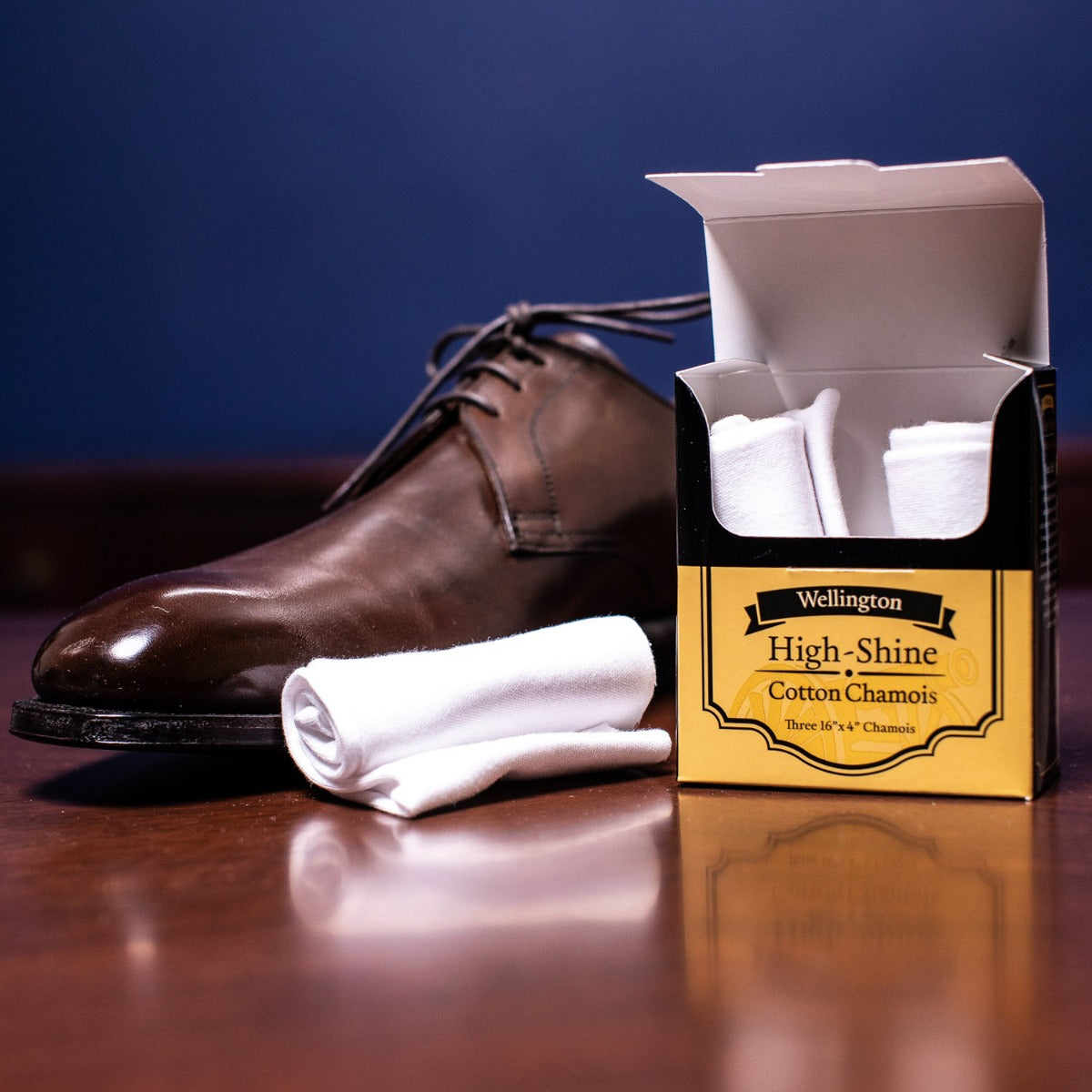 A pair of brown shoes and a box of high-shine cloths for the KirbyAllison.com Wellington High Shine Interlocking Cotton Chamois (Set of 3).