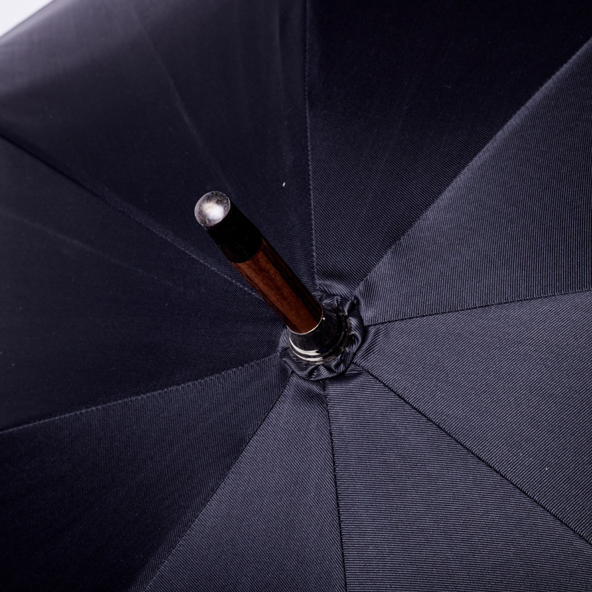 A handcrafted Black Pigskin Solid Stick Umbrella with Black Canopy from KirbyAllison.com.