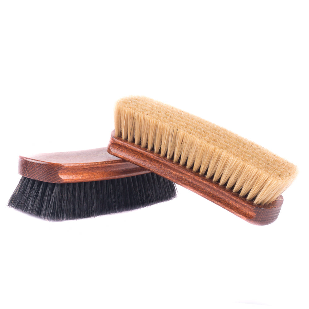 A pair of Deluxe Wellington Pig Bristle Shoe Polishing Brushes with pig bristles on a white background from KirbyAllison.com.