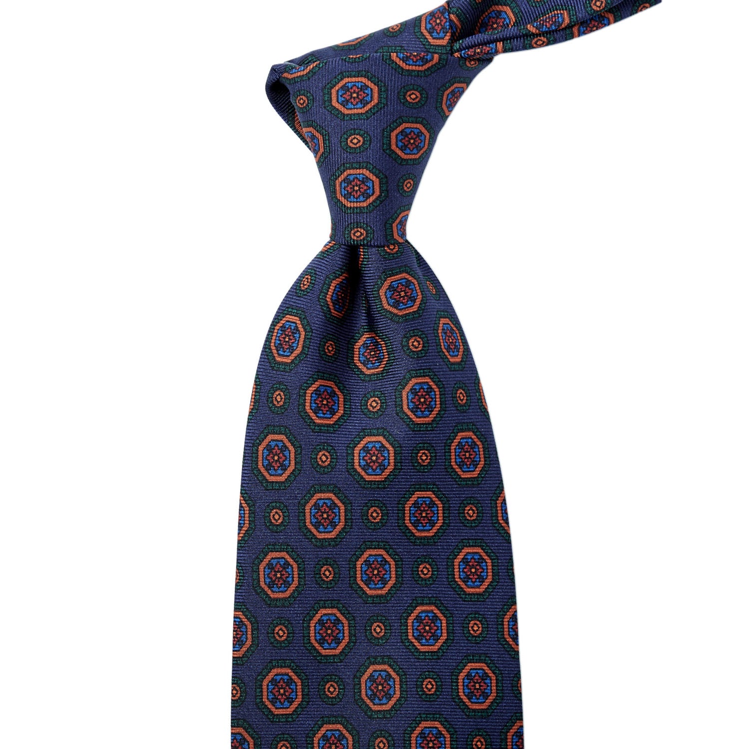 Handmade in the United Kingdom, this Sovereign Grade Dark Navy Geometric Ancient Madder Tie (150x8.5 cm) from KirbyAllison.com features a circular pattern of highest quality.