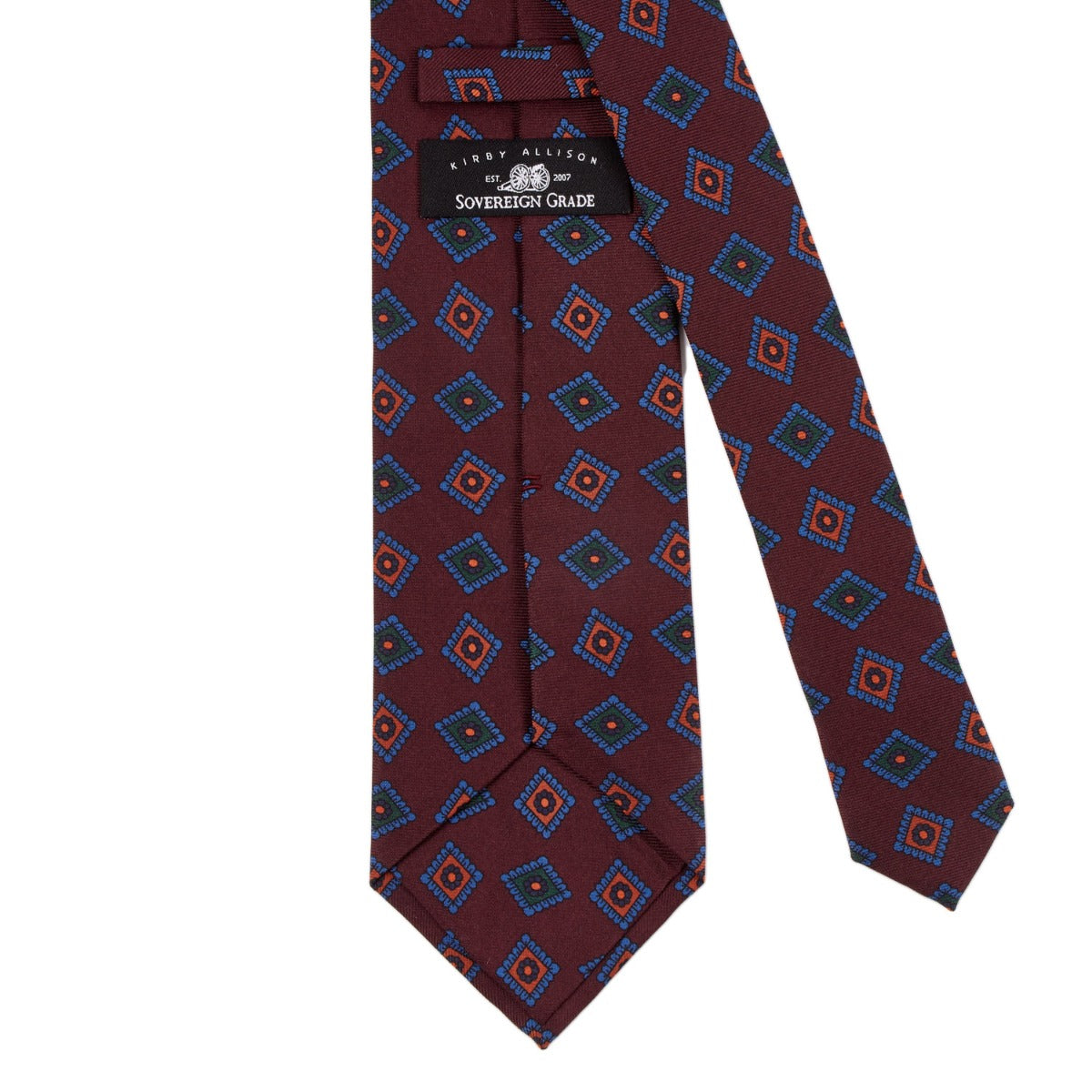 A Sovereign Grade Burgundy Art Deco Ancient Madder Silk Tie from KirbyAllison.com with a quality blue and red pattern from the United Kingdom.