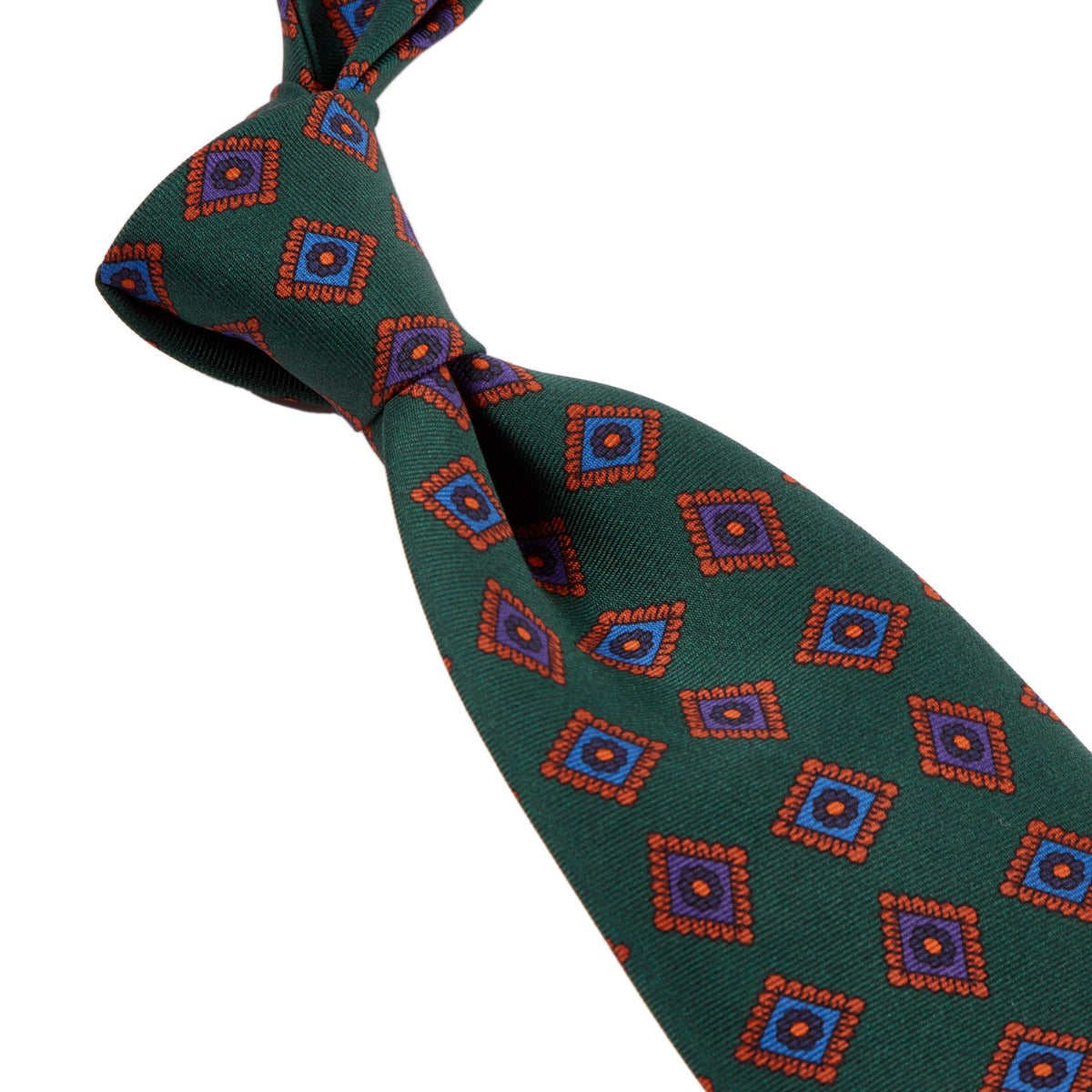A Sovereign Grade Forrest Green Art Deco Ancient Madder Silk Tie from KirbyAllison.com with a red, blue, and green pattern.