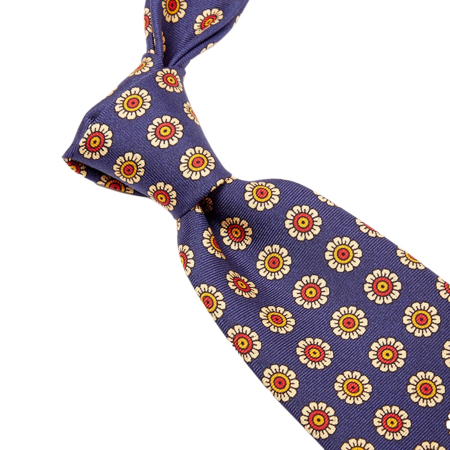 A Sovereign Grade Navy Daisy Spring Madder Buff Tie (150x8.5 cm) made from 100% English silk, available at KirbyAllison.com.