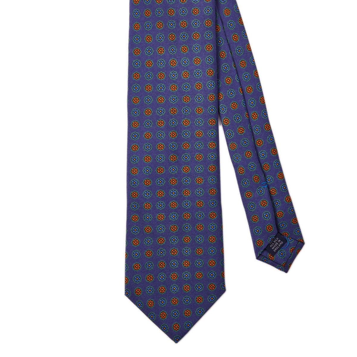 A high-quality Sovereign Grade Blue Medallion Jacquard Silk Tie from KirbyAllison.com with polka dots in blue and orange.