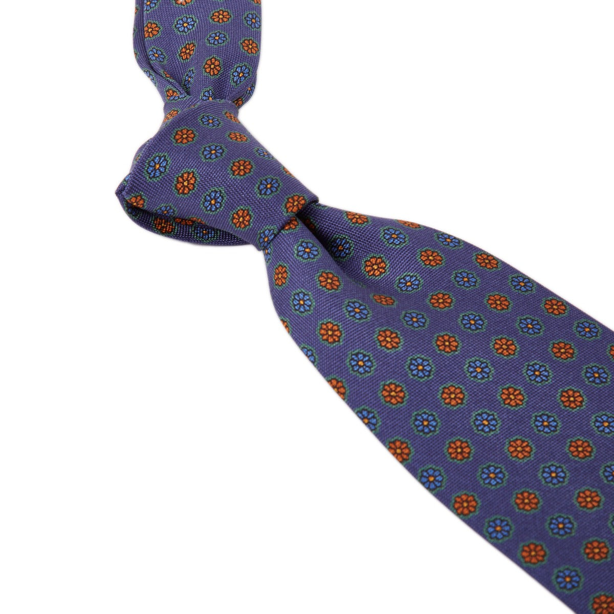 A Sovereign Grade Blue Medallion Jacquard Silk Tie by KirbyAllison.com with quality orange and blue polka dots.