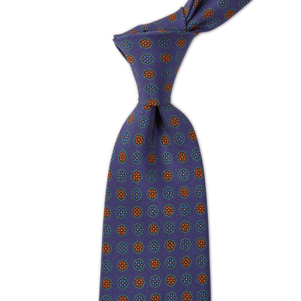A high-quality Sovereign Grade Blue Medallion Jacquard Silk Tie with an orange and blue pattern, made in the United Kingdom, from KirbyAllison.com.