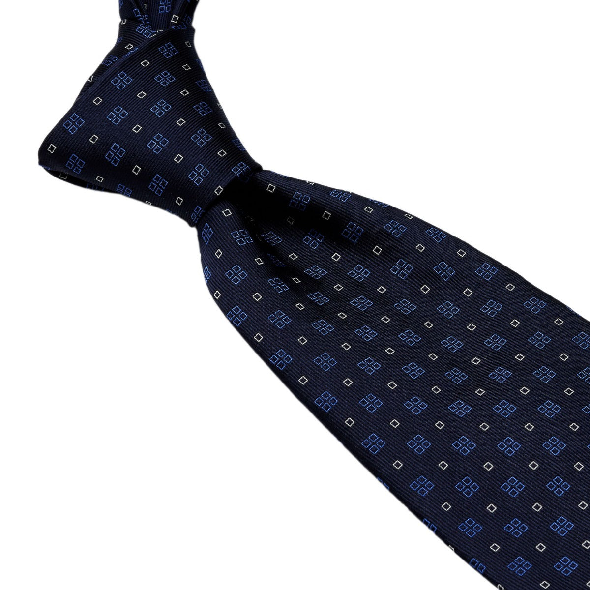 A handmade Sovereign Grade Navy Alternating Square Jacquard Tie from KirbyAllison.com with a blue and white pattern, from the United Kingdom.