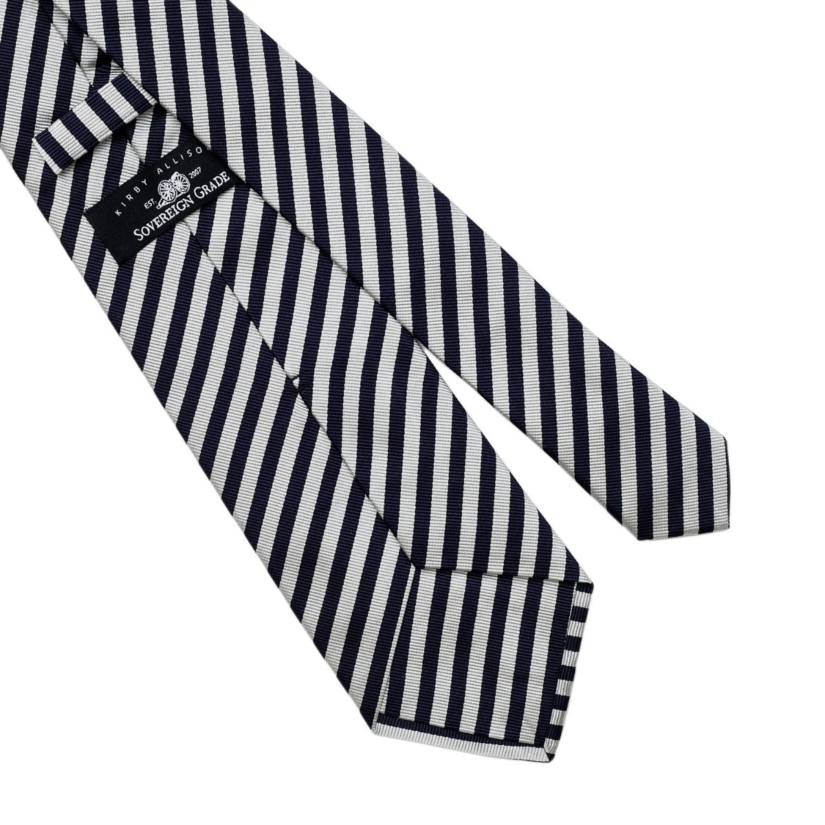 A Sovereign Grade Navy and Silver London Stripe Silk Tie on a white background, from KirbyAllison.com in the United Kingdom.