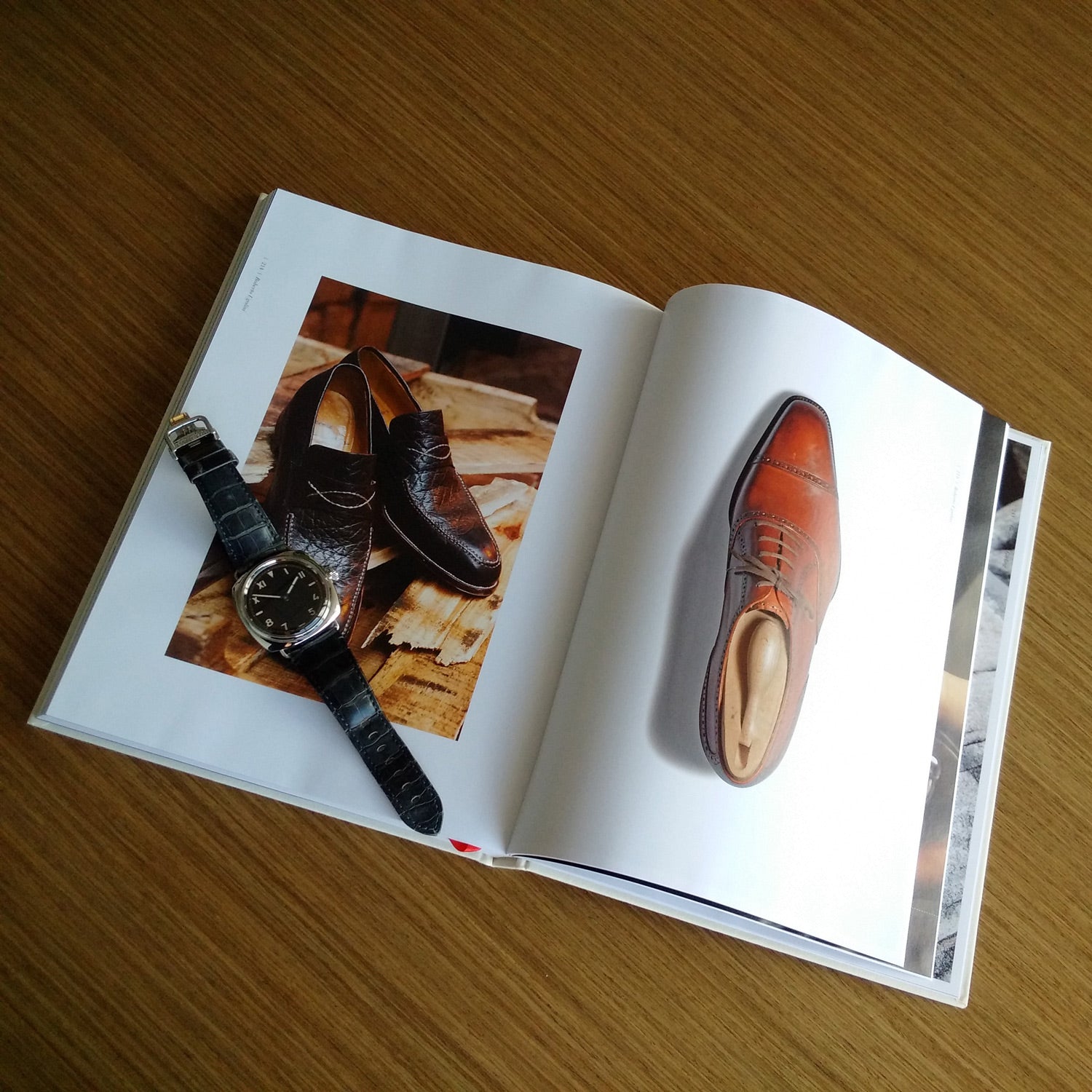 A photobook showcasing Master Shoemakers: The Art and Soul of Bespoke Shoes made by expert shoemakers, with a watch from KirbyAllison.com as an added accessory.