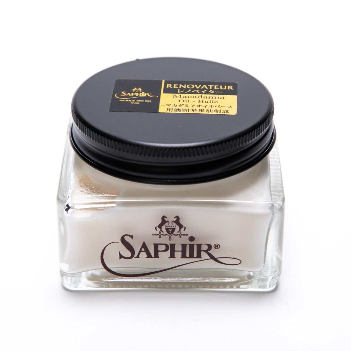 A jar of Saphir Renovateur w/ Macadamia Oil conditioner by KirbyAllison.com with a label on it.