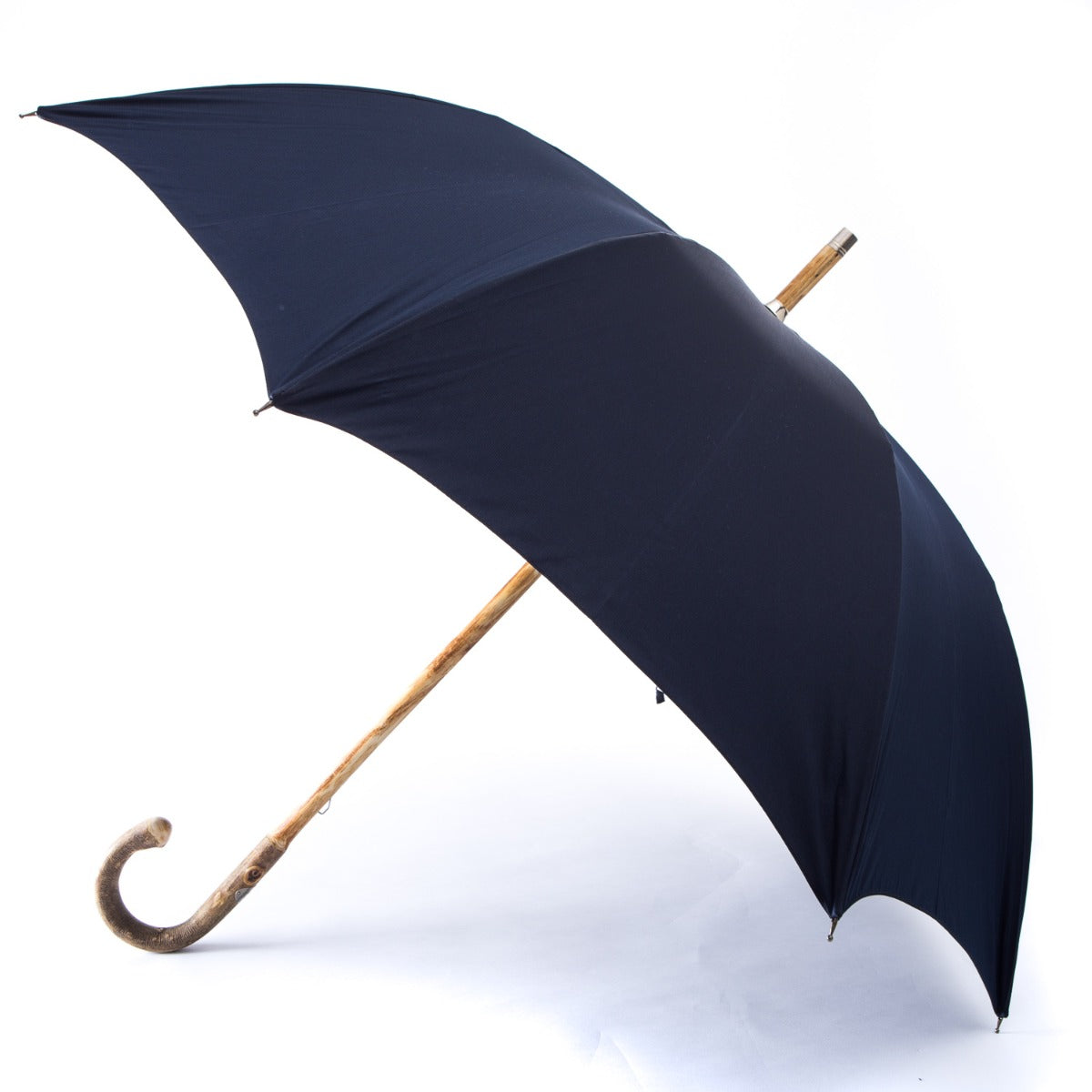 A gentleman's umbrella with a Ashwood Solid Stick Umbrella with Navy Canopy handle, sold by KirbyAllison.com.