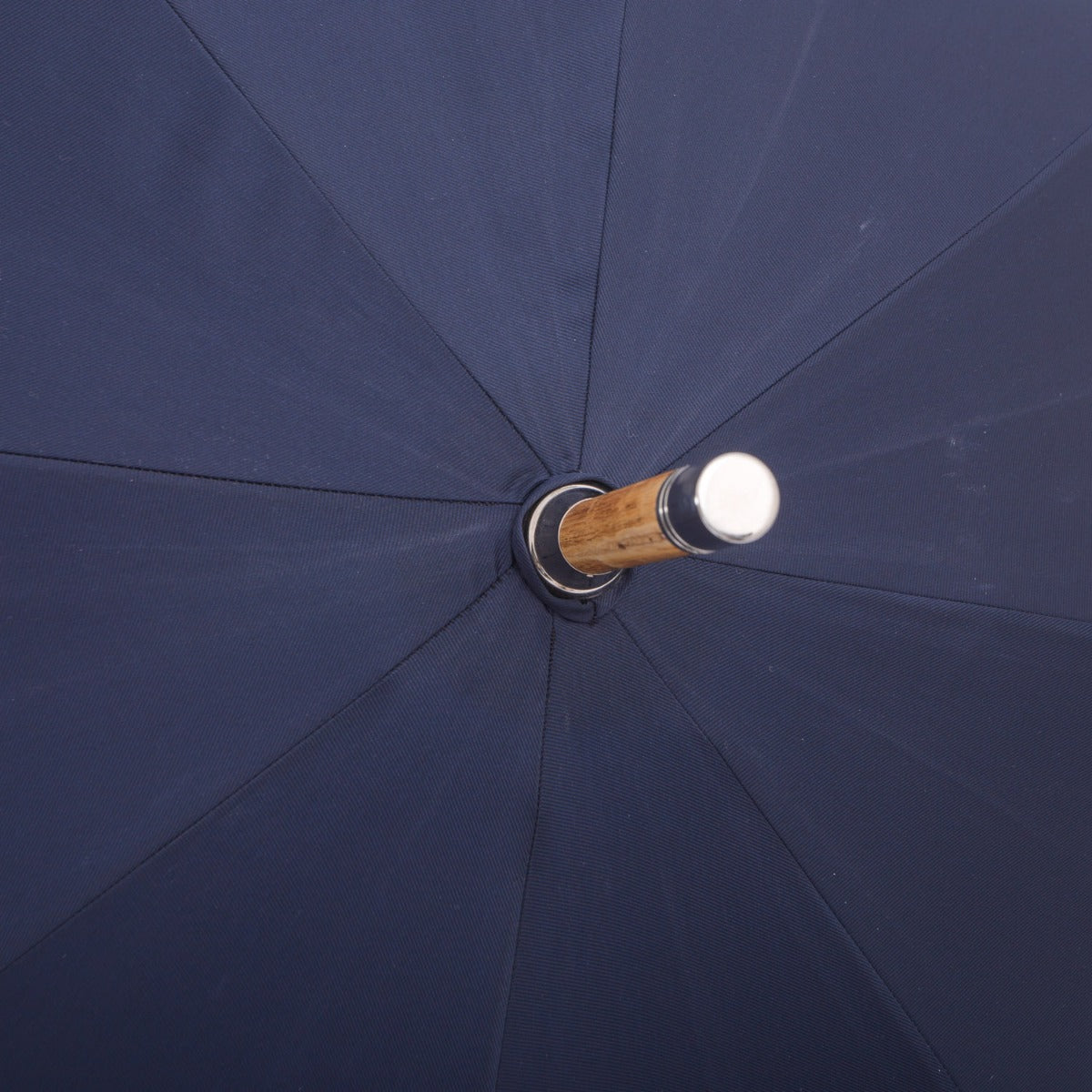 A KirbyAllison.com Ashwood Solid Stick Umbrella with Navy Canopy.
