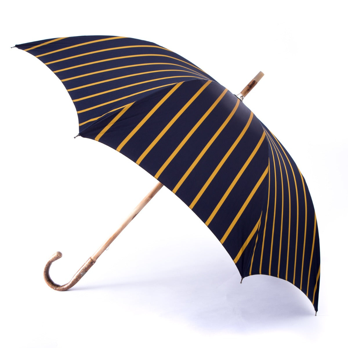 A handmade Walnut Solid Stick Umbrella with Navy Stripe Canopy from KirbyAllison.com.