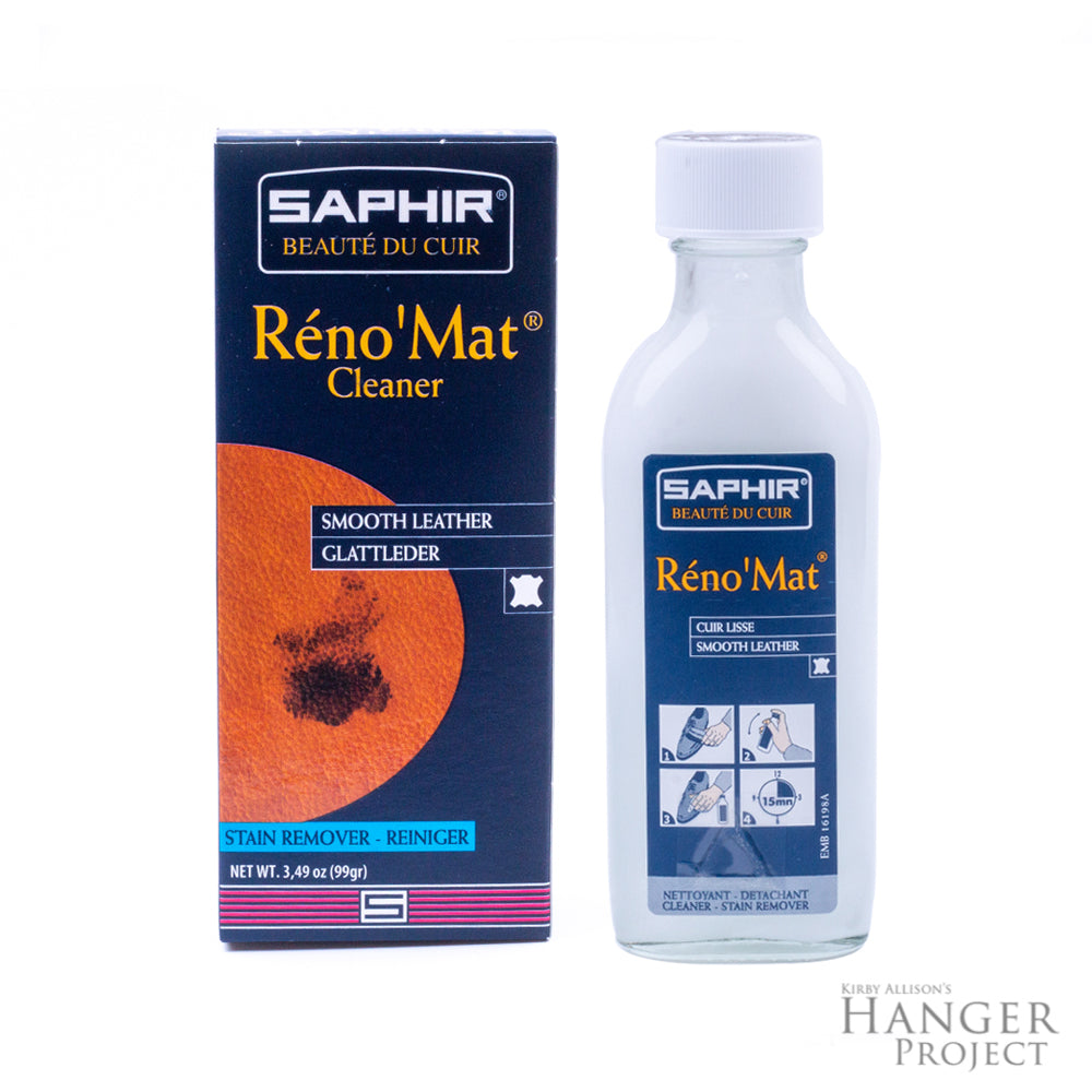 A bottle of Saphir Reno'Mat Leather Cleaner by KirbyAllison.com with a box next to it.