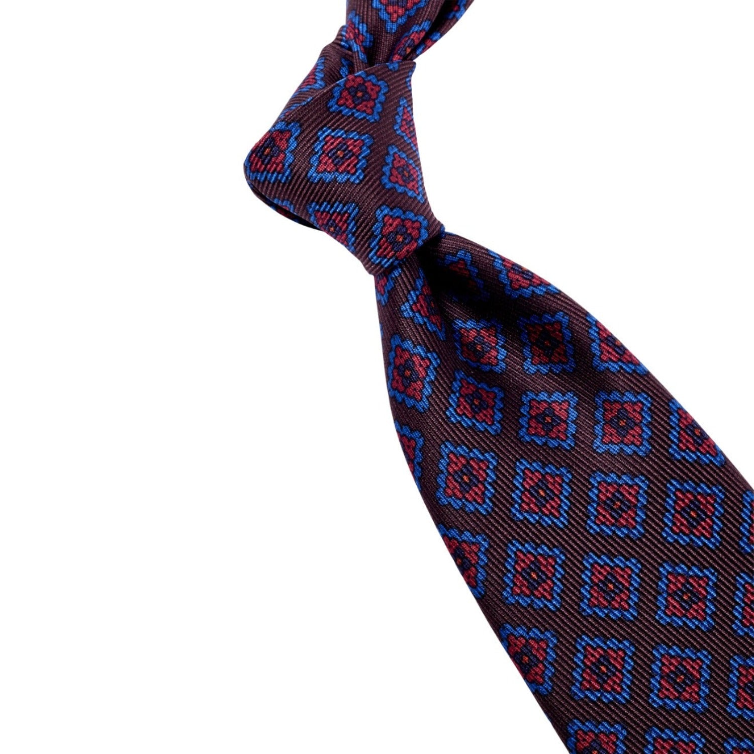 A handmade Kirby Allison Sovereign Grade Brown Diamond Ancient Madder Silk Tie, with a red and blue pattern, crafted from 100% English silk in the United Kingdom.