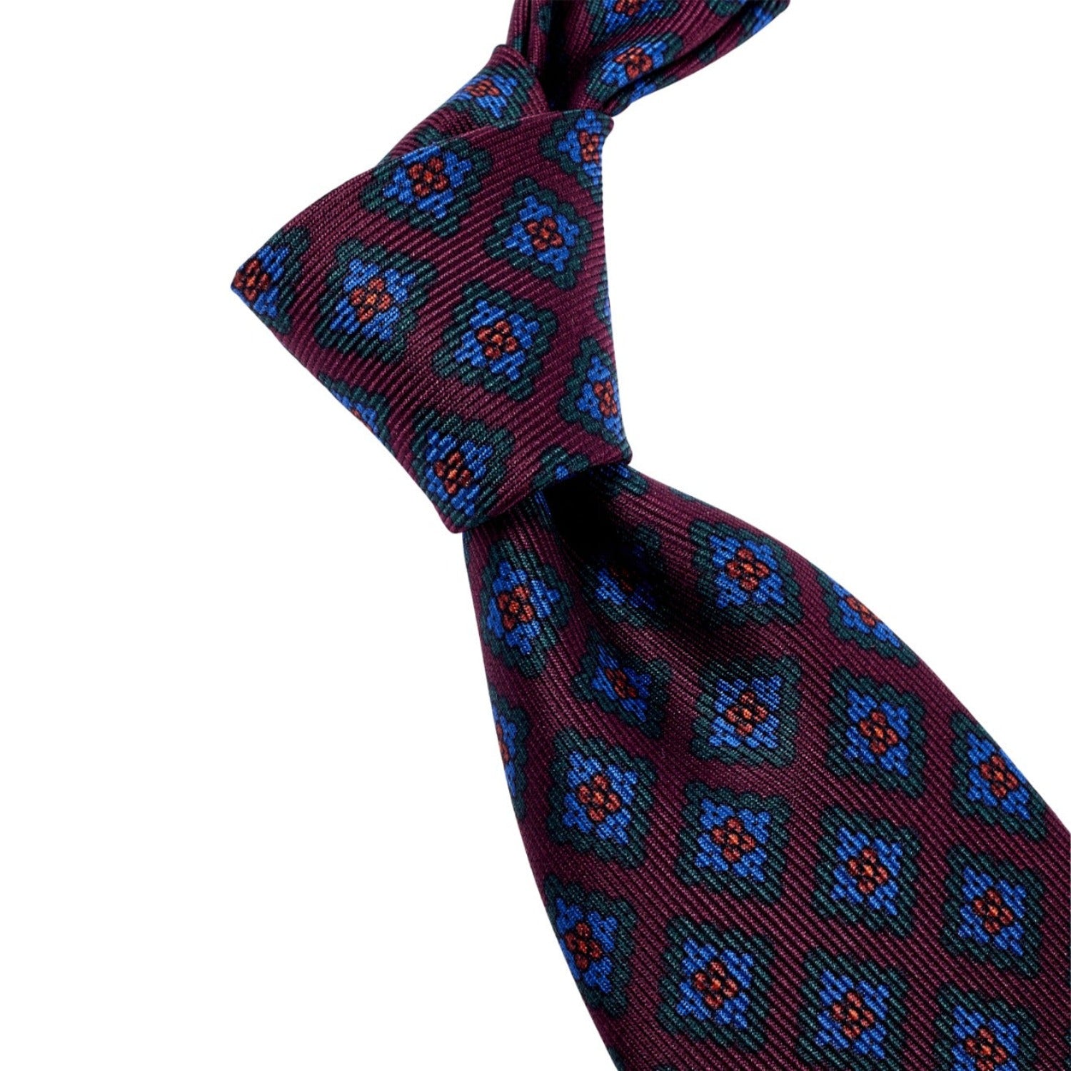 A high-quality Sovereign Grade Burgundy Diamond Ancient Madder Silk Tie with blue and red designs, crafted by hand from KirbyAllison.com.
