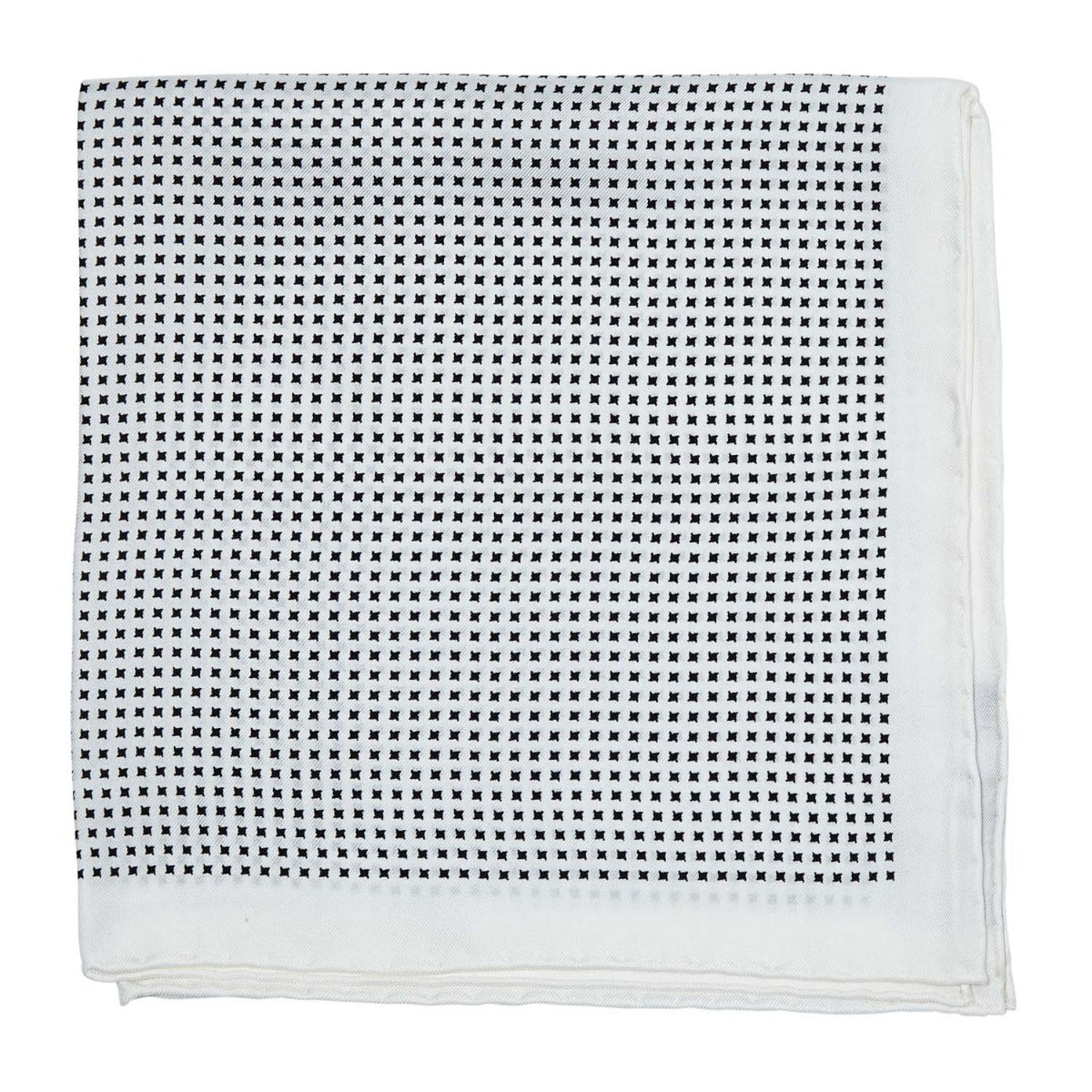 A formal Sovereign Grade 100% Silk White Repeating Black Star pocket square adorned with black dots to enhance your wardrobe, available at KirbyAllison.com.