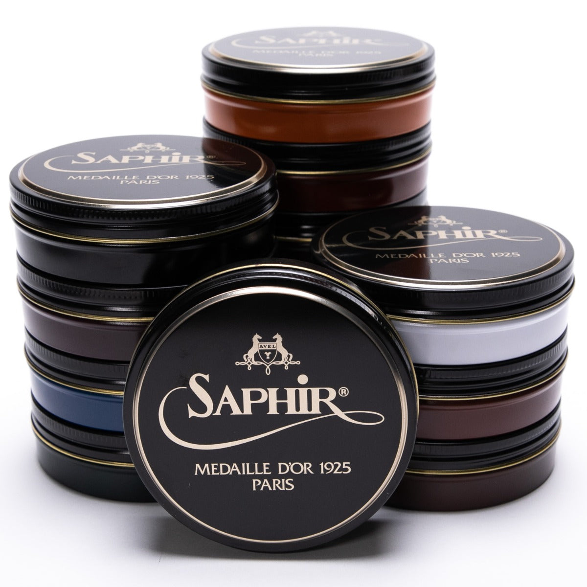 A group of tins with the word KirbyAllison.com on them, containing Saphir Pate de Luxe Wax Shoe Polish 100 ml for achieving a high-gloss shine.