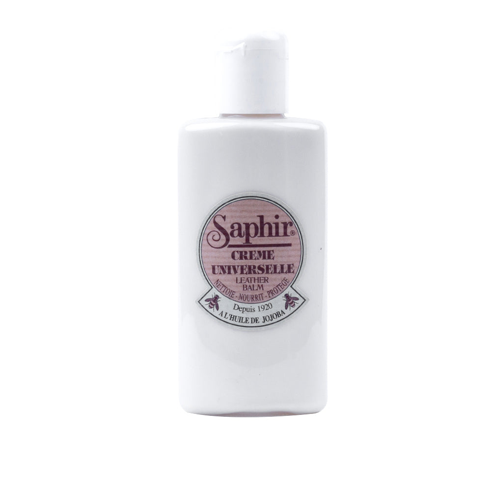 A bottle of KirbyAllison.com Saphir Universal Cream Polish nourishing leather goods on a white background.
