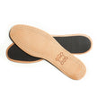 A pair of Saphir Leather Insoles with sheepskin top on a white background has been replaced with "A pair of Saphir Leather Insole w Charcoal Bottom from KirbyAllison.com.