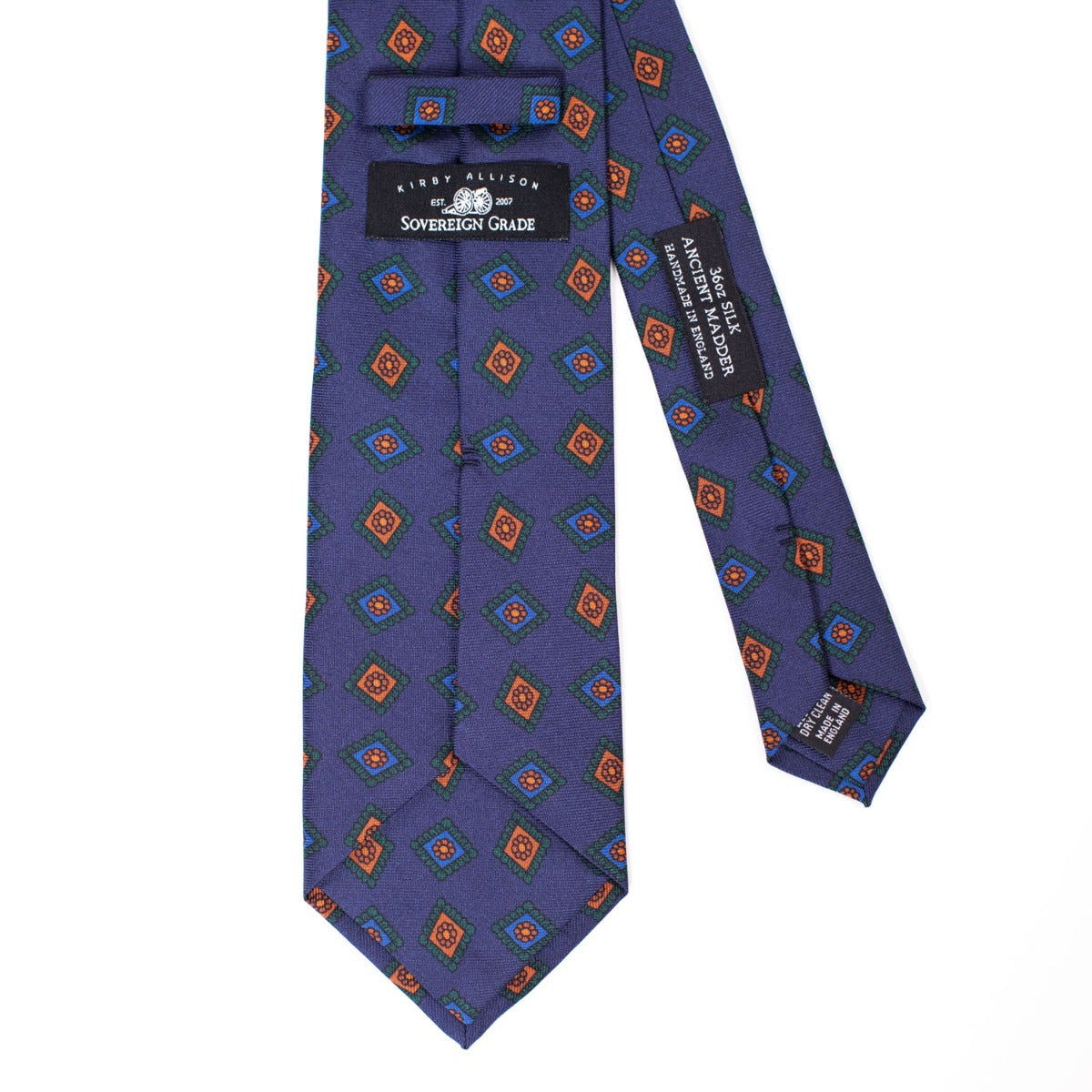 A quality Sovereign Grade Navy w/Green Art Deco Ancient Madder necktie from KirbyAllison.com with a purple, orange, and blue pattern.