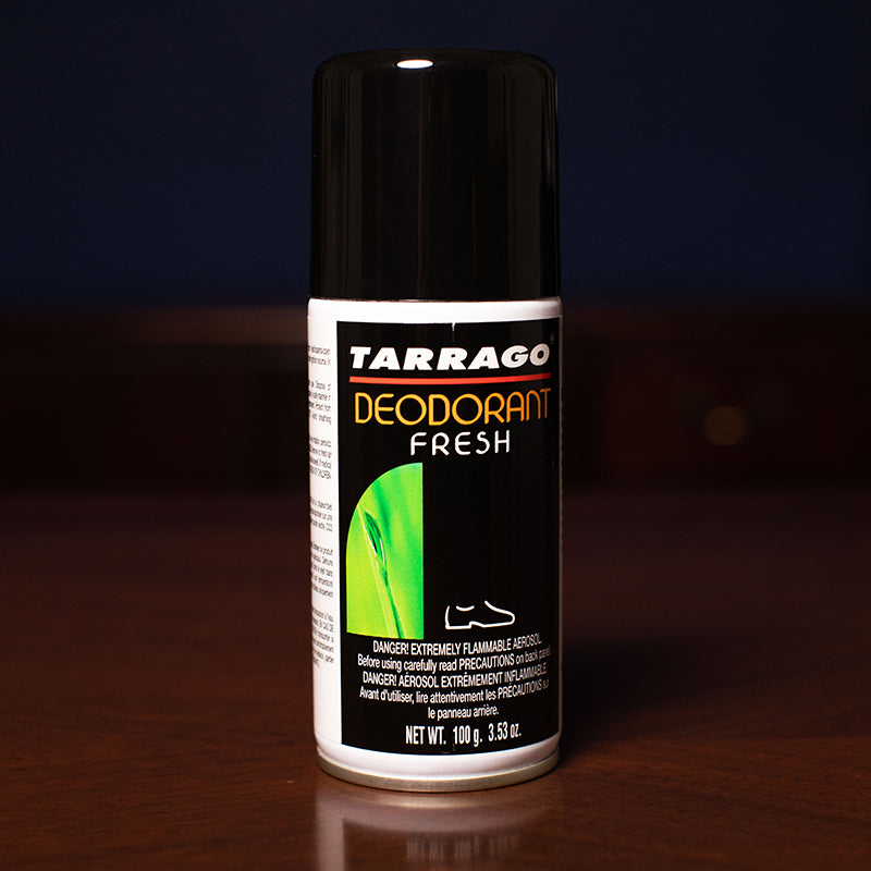 A bottle of Tarrago Fresh Deodorizing Spray by KirbyAllison.com sitting on a table.