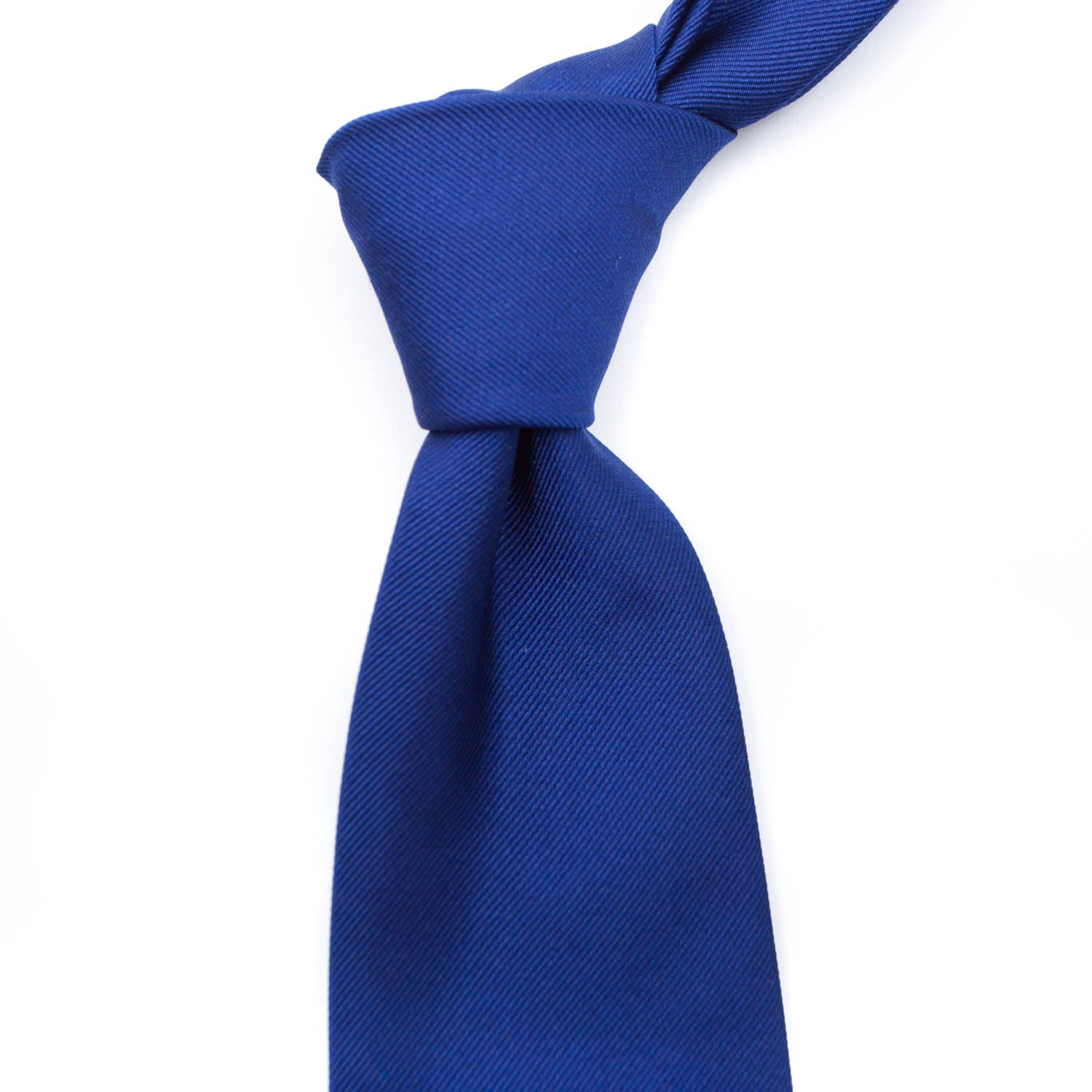 A handmade Sovereign Grade Blue Satin Tie on a white background, featuring KirbyAllison.com's quality and superior longevity.