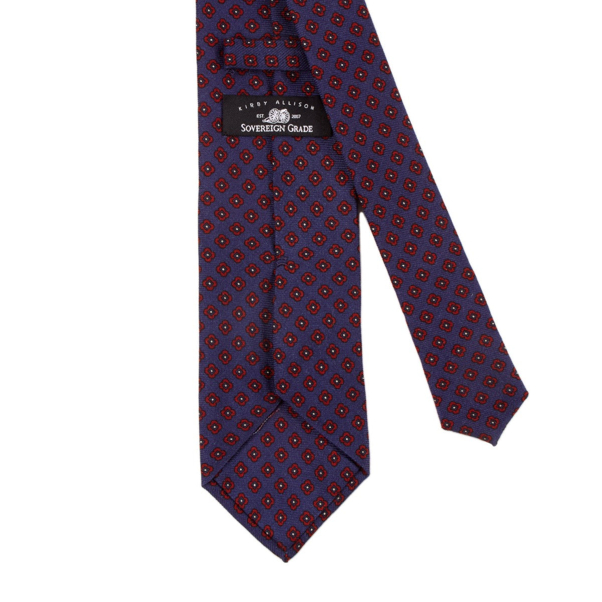 A handmade Sovereign Grade Butcher Blue Small Floral Wool Challis tie from KirbyAllison.com with a polka dot pattern.
