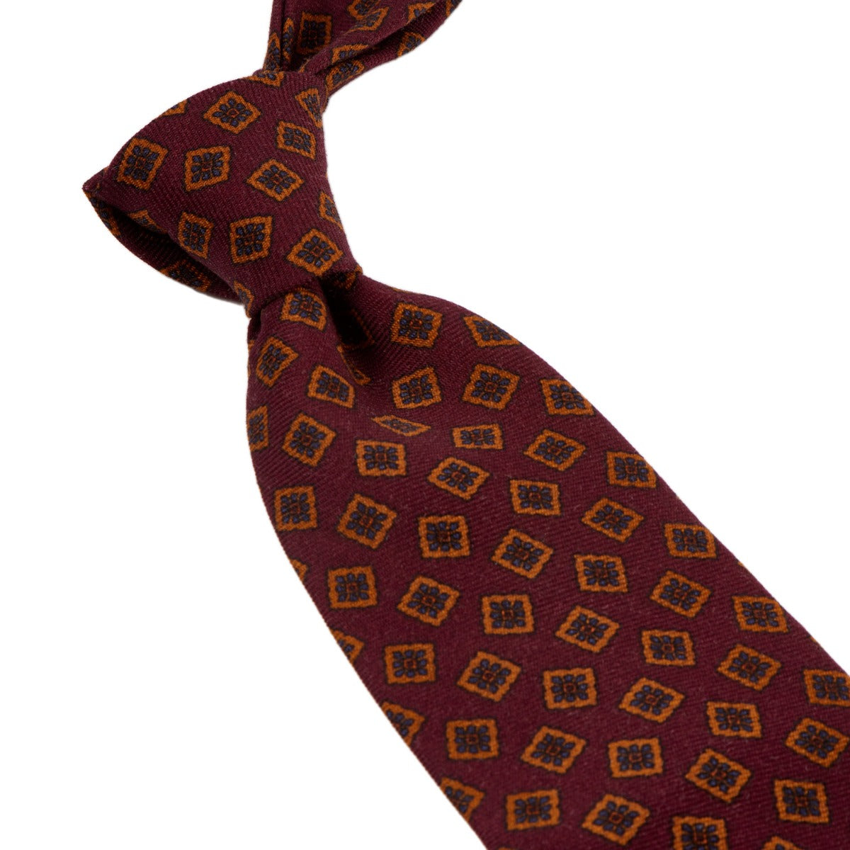 A Sovereign Grade Burgundy Tossed Square Wool Challis Tie with highest quality brown and orange designs, handmade in the United Kingdom from KirbyAllison.com.