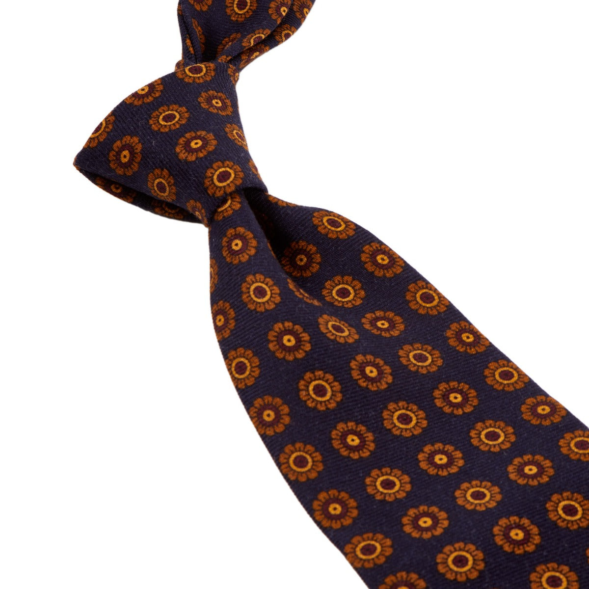 A Sovereign Grade Navy Daisy Wool Challis Tie with orange and blue flowers on it from KirbyAllison.com, United Kingdom.