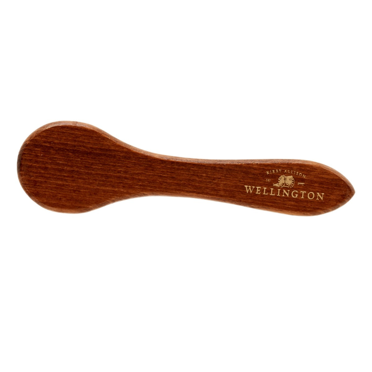 A wooden spoon with the word wellington on it, enhanced by the KirbyAllison.com Wellington Deluxe Shoe Polish Dauber.