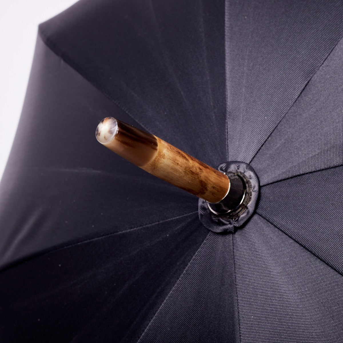 A Palundio umbrella with a wooden handle from KirbyAllison.com.